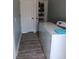 Laundry room with washer and dryer and additional storage space at 1609 17Th W St, Bradenton, FL 34205