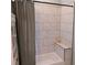 Close up of the shower and bathtub in this bathroom with white tiled walls at 1609 17Th W St, Bradenton, FL 34205