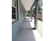 Inviting outdoor walkway featuring classic architectural columns and exterior lighting at 1609 17Th W St, Bradenton, FL 34205