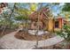 The backyard features a pergola, stone patio, and decorative elements at 1721 8Th Street, Sarasota, FL 34236