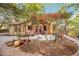 Secluded backyard with stone patio, wooden pergola, and lush landscaping at 1721 8Th Street, Sarasota, FL 34236