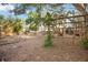Spacious backyard with gardening structure, perfect for outdoor enjoyment at 1721 8Th Street, Sarasota, FL 34236