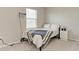 Bedroom featuring neutral tones, a window, and a mounted projector at 17669 Cantarina Cv, Bradenton, FL 34211