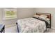 Cozy bedroom with natural light from window and paris-themed bedspread at 17669 Cantarina Cv, Bradenton, FL 34211