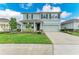 Charming two-story home with a well-maintained lawn, beautiful landscaping, and a two-car garage at 17669 Cantarina Cv, Bradenton, FL 34211