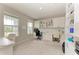 Spacious home office with custom built-ins, two desks, and plenty of natural light at 17669 Cantarina Cv, Bradenton, FL 34211