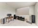 Cozy living area featuring a mounted projector screen for modern entertainment at 17669 Cantarina Cv, Bradenton, FL 34211