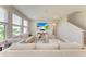 Bright living room offers comfortable seating and a large window with natural light at 17669 Cantarina Cv, Bradenton, FL 34211