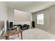 Living room featuring a desk, a window, and carpeted floors at 17669 Cantarina Cv, Bradenton, FL 34211