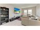 Cozy loft area with comfortable seating, media center, and plenty of natural light at 17669 Cantarina Cv, Bradenton, FL 34211