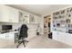 Functional office space with built-in shelving, dual desks, and ample storage for productivity and organization at 17669 Cantarina Cv, Bradenton, FL 34211