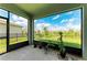 Screened patio overlooking a lush backyard and green space, perfect for relaxing at 17669 Cantarina Cv, Bradenton, FL 34211