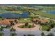 Panoramic aerial shot of Sarasota National community showcasing lakes, golf course, and clubhouse at 23572 Awabuki Dr # 202, Venice, FL 34293
