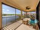 Spacious lanai offering seating and panoramic views of the surrounding landscape at 23572 Awabuki Dr # 202, Venice, FL 34293