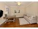 Living room with hard wood floors, ceiling fan, and comfortable seating at 23572 Awabuki Dr # 202, Venice, FL 34293