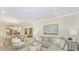 Spacious living area combining the living room, dining room, and kitchen for seamless entertaining and relaxation at 23819 Collina Way # 102, Port Charlotte, FL 33980