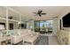 Inviting living room with cozy seating, stylish decor, and sliding glass doors to the outdoor living space at 23819 Collina Way # 102, Port Charlotte, FL 33980