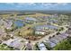 Aerial view of residential community featuring multiple ponds, landscaping, and community amenities at 259 Tierra Verde Way, Bradenton, FL 34212