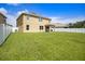 Spacious, well-kept backyard features green grass and white perimeter fencing at 259 Tierra Verde Way, Bradenton, FL 34212