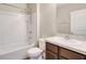 A well-lit bathroom features a shower-tub combination and a dark vanity at 259 Tierra Verde Way, Bradenton, FL 34212