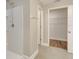 Bright bathroom with a tiled shower, neutral walls, and tiled floor, with an open closet at 259 Tierra Verde Way, Bradenton, FL 34212