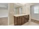 Bathroom featuring double vanity and large mirror at 259 Tierra Verde Way, Bradenton, FL 34212