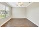 Bedroom showcasing hardwood flooring, a ceiling fan and natural light from the window at 259 Tierra Verde Way, Bradenton, FL 34212