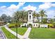 Del Tierra community entrance with lush green grass and a decorative white tower under blue skies at 259 Tierra Verde Way, Bradenton, FL 34212