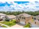 Two-story home boasting well-maintained landscaping, a two-car garage, and neutral stucco at 259 Tierra Verde Way, Bradenton, FL 34212