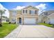 Charming two-story home with a neatly paved driveway and a well-manicured front yard at 259 Tierra Verde Way, Bradenton, FL 34212