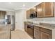 Spacious kitchen featuring granite countertops and stainless steel appliances with tile flooring at 259 Tierra Verde Way, Bradenton, FL 34212
