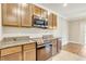 Modern kitchen boasts stainless steel appliances, granite countertops, and ample storage space at 259 Tierra Verde Way, Bradenton, FL 34212