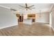 Open-concept kitchen with stainless steel appliances, a center island, and hardwood floors at 259 Tierra Verde Way, Bradenton, FL 34212