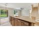 Kitchen island with granite countertop and stainless steel dishwasher and sink at 259 Tierra Verde Way, Bradenton, FL 34212