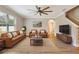 Cozy living room featuring hardwood floors, a ceiling fan, and neutral walls at 259 Tierra Verde Way, Bradenton, FL 34212