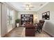 Home office features built-in bookshelf, ceiling fan, and large window for natural light at 259 Tierra Verde Way, Bradenton, FL 34212