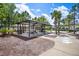 Outdoor picnic pavilion with tables and seating, surrounded by mature trees and landscaping, great for gatherings at 259 Tierra Verde Way, Bradenton, FL 34212