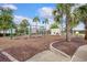 Community playground featuring swings, a climbing wall, and lush landscaping, perfect for outdoor fun at 259 Tierra Verde Way, Bradenton, FL 34212