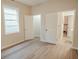 This bedroom features two open doorways and vinyl flooring at 2613 N 21St St, Tampa, FL 33605