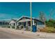 Charming street view showcases inviting front porch and classic architecture, presenting a warm welcome to this lovely home at 2613 N 21St St, Tampa, FL 33605