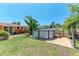 Well-maintained backyard featuring an above-ground pool, patio area, and mature trees at 3053 Monica Pkwy, Sarasota, FL 34234