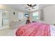Bedroom with ceiling fan, tile flooring, and built-in dresser for ample storage at 3053 Monica Pkwy, Sarasota, FL 34234