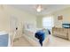 Bright bedroom with ceiling fan and desk with a chair at 3053 Monica Pkwy, Sarasota, FL 34234