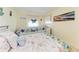 Comfortable bedroom featuring nautical-themed bedding and decor, creating a serene and relaxing atmosphere at 3053 Monica Pkwy, Sarasota, FL 34234