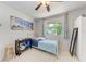 Bright bedroom with large window and closet at 3053 Monica Pkwy, Sarasota, FL 34234