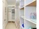 Organized walk-in closet with shelving and hanging storage at 3053 Monica Pkwy, Sarasota, FL 34234