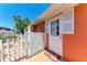 Charming home entryway with white picket fence, welcoming door, and inviting sunflower welcome mat at 3053 Monica Pkwy, Sarasota, FL 34234