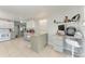 Open kitchen with an island, breakfast bar, and modern appliances at 3053 Monica Pkwy, Sarasota, FL 34234