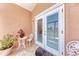 Private outdoor patio featuring tile flooring and stylish furnishings, perfect for relaxation at 3053 Monica Pkwy, Sarasota, FL 34234