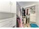 Spacious walk-in closet with custom shelving and ample storage space at 3053 Monica Pkwy, Sarasota, FL 34234